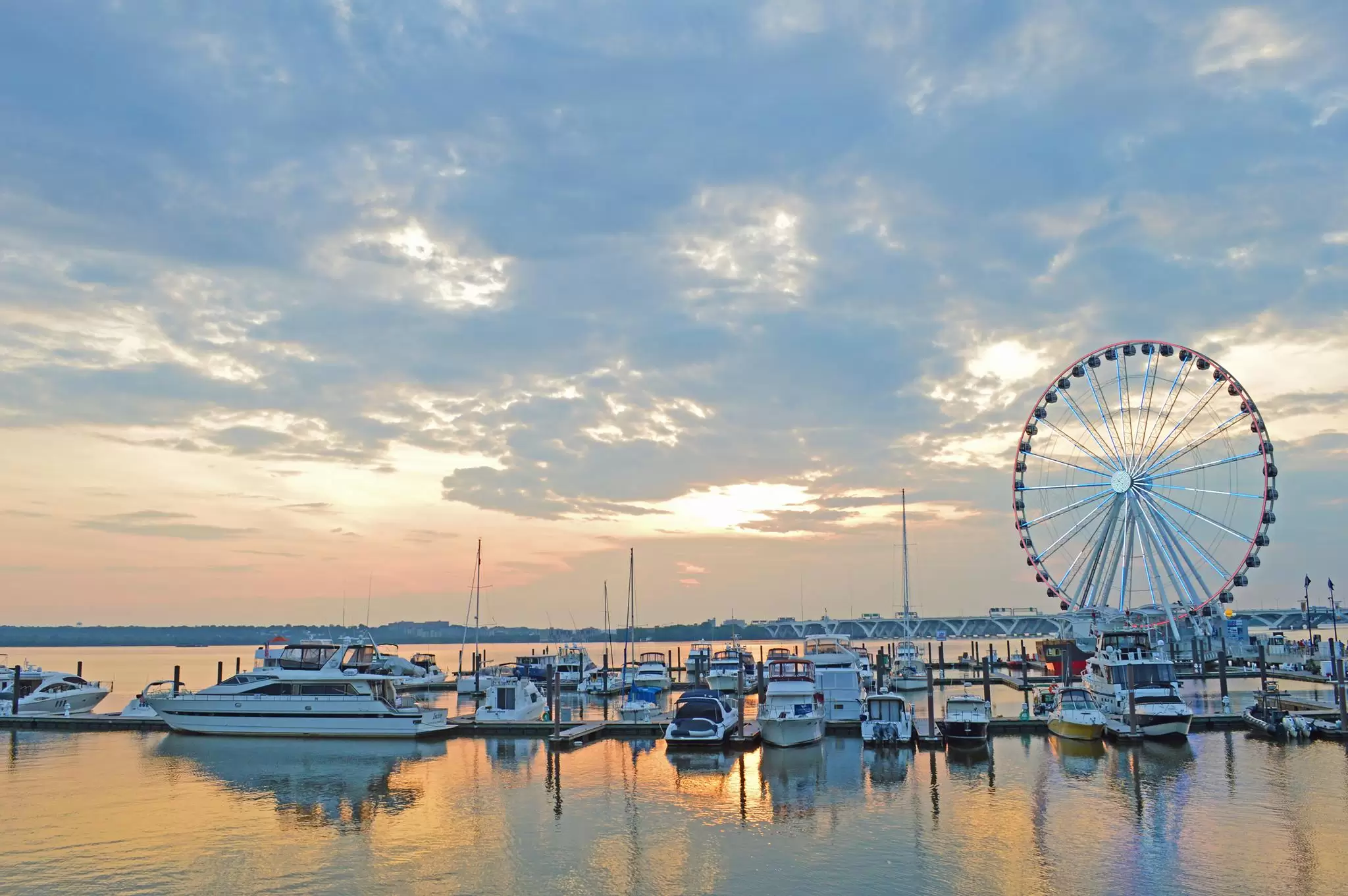 The Capital Wheel and marina at National Harbor at sunset